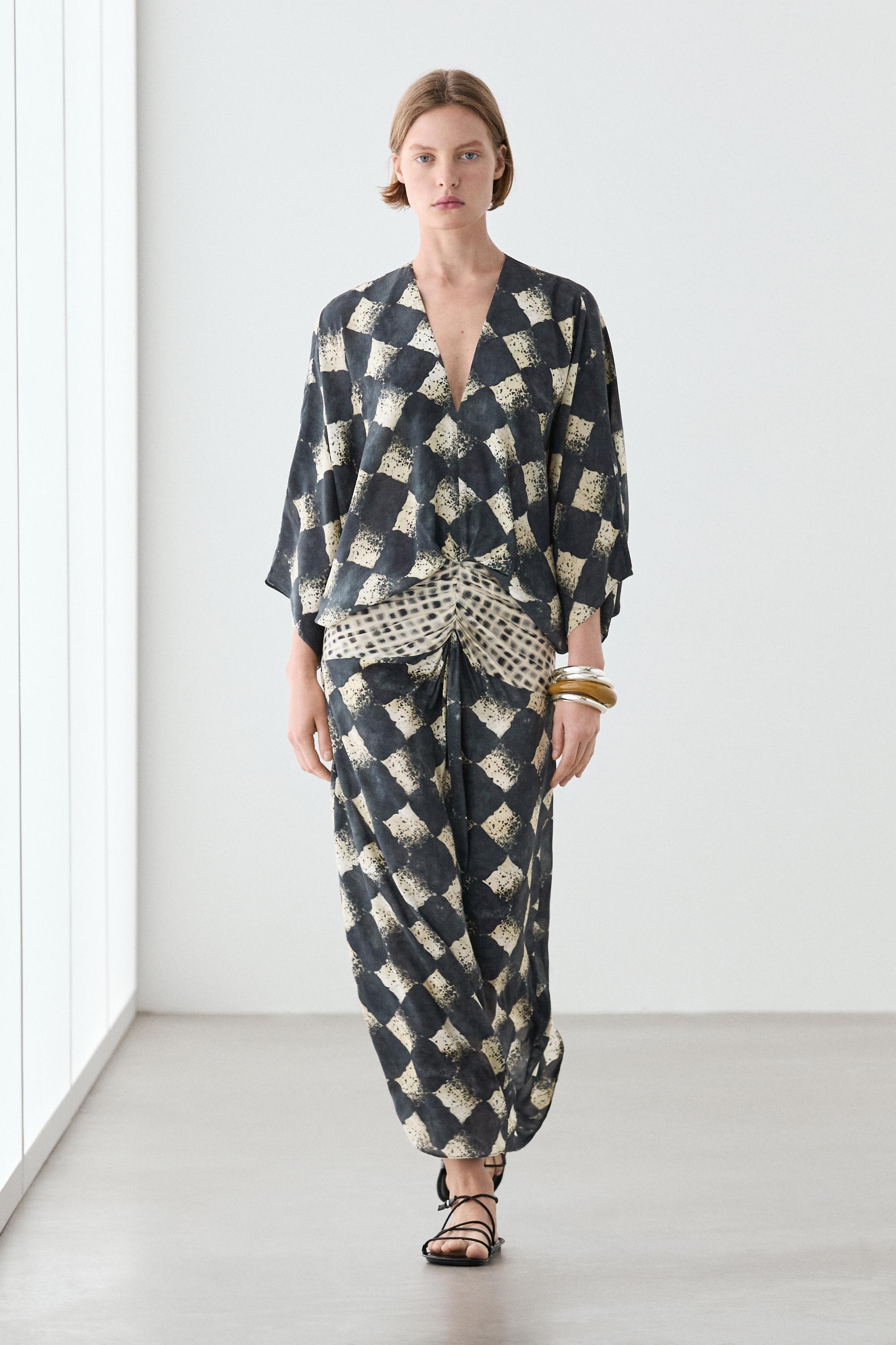 Flowing dress with sash belt detail